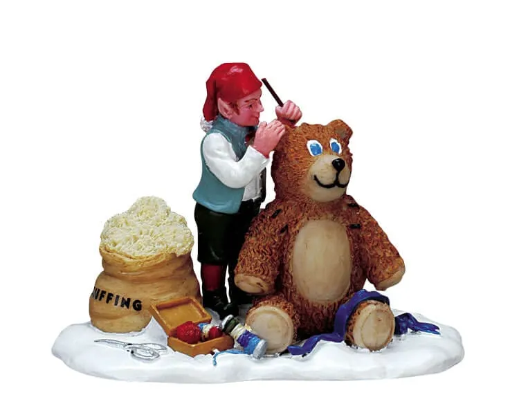 lemax-tending-to-teddy-kind-mit-teddy-miniaturfigur image 1